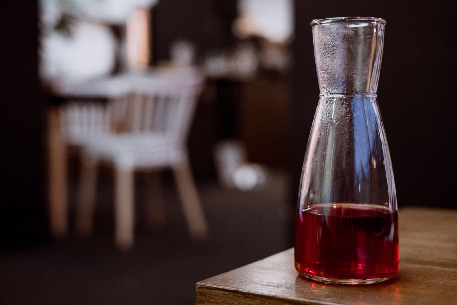 A plain glass carafe on a table
