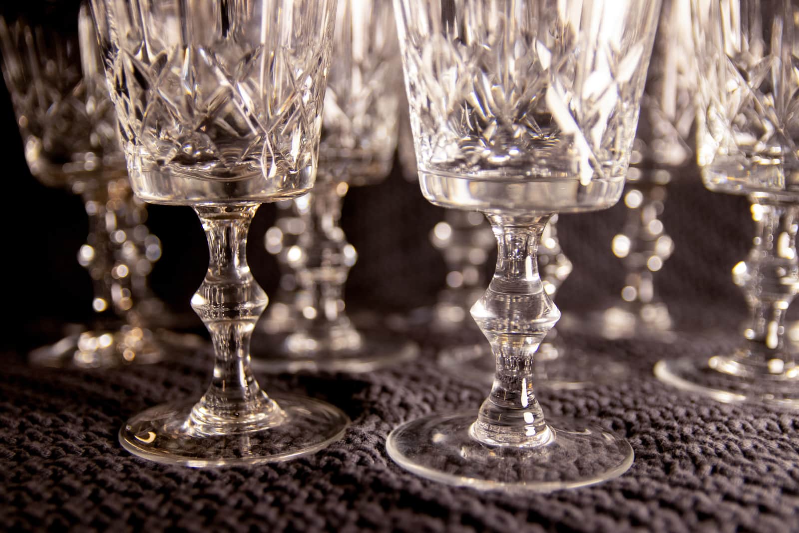 Cut crystal glassware in warm light