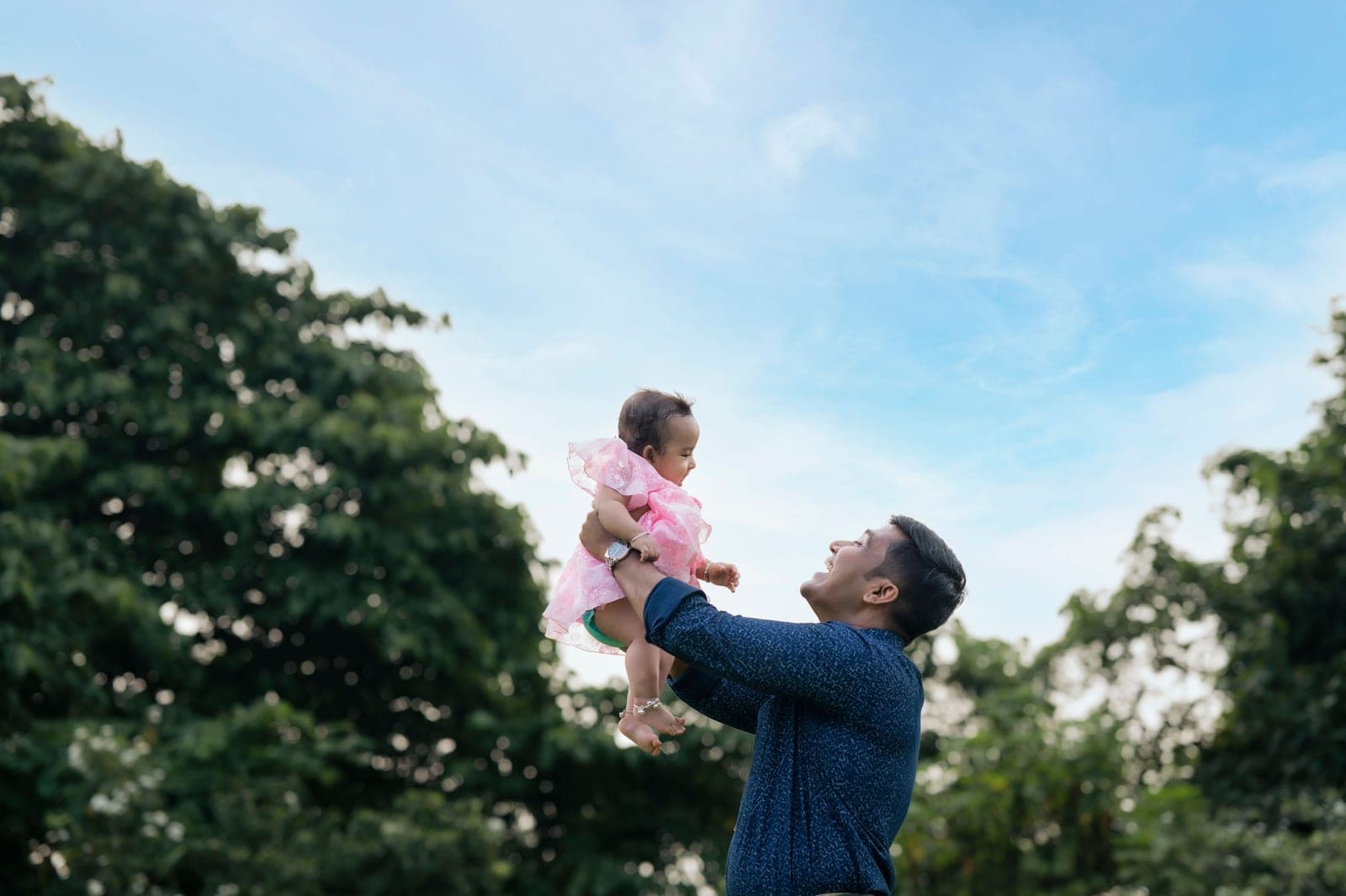 A father and child outdoors on a summer afternoon