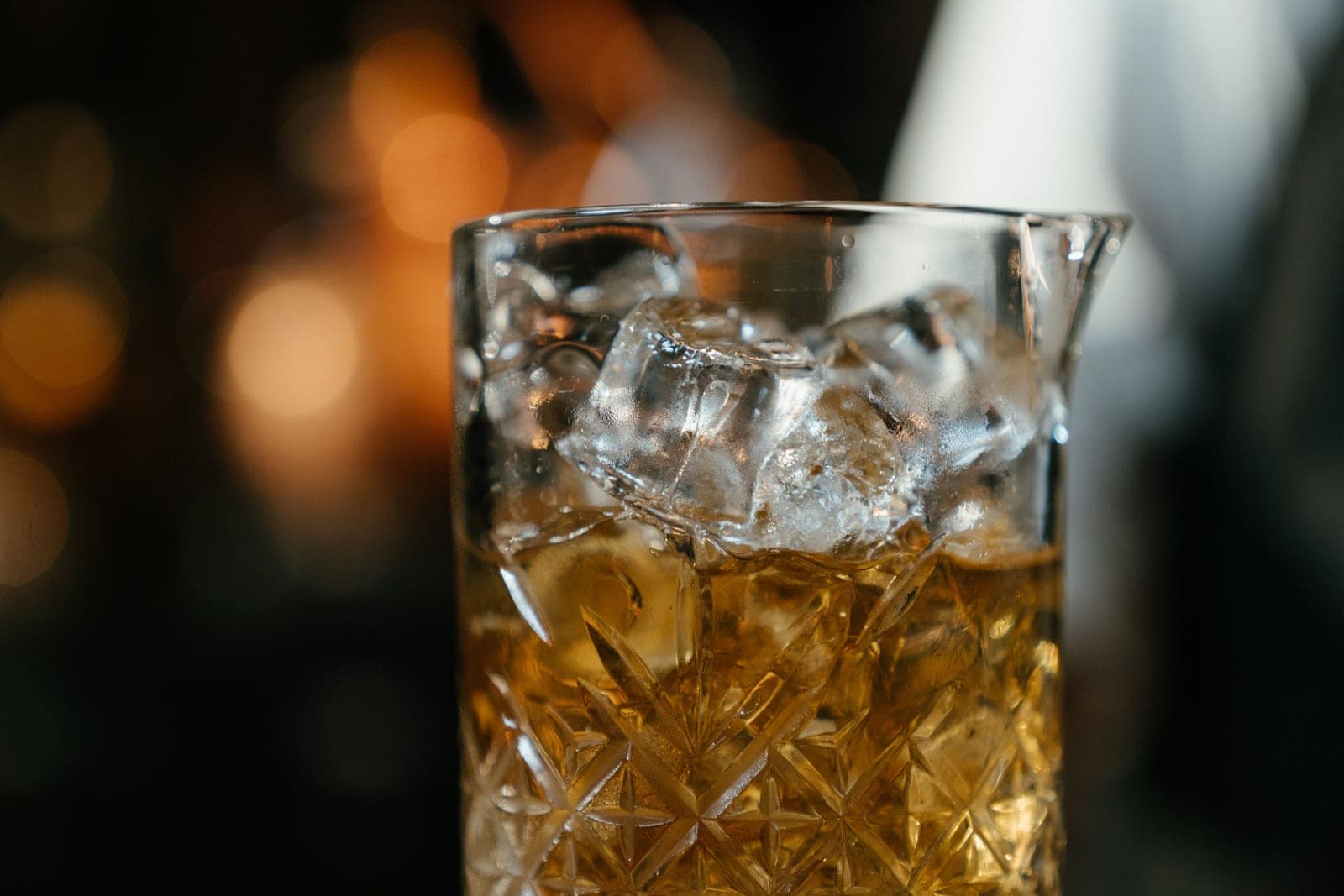 Ice cubes melting in a glass tumbler