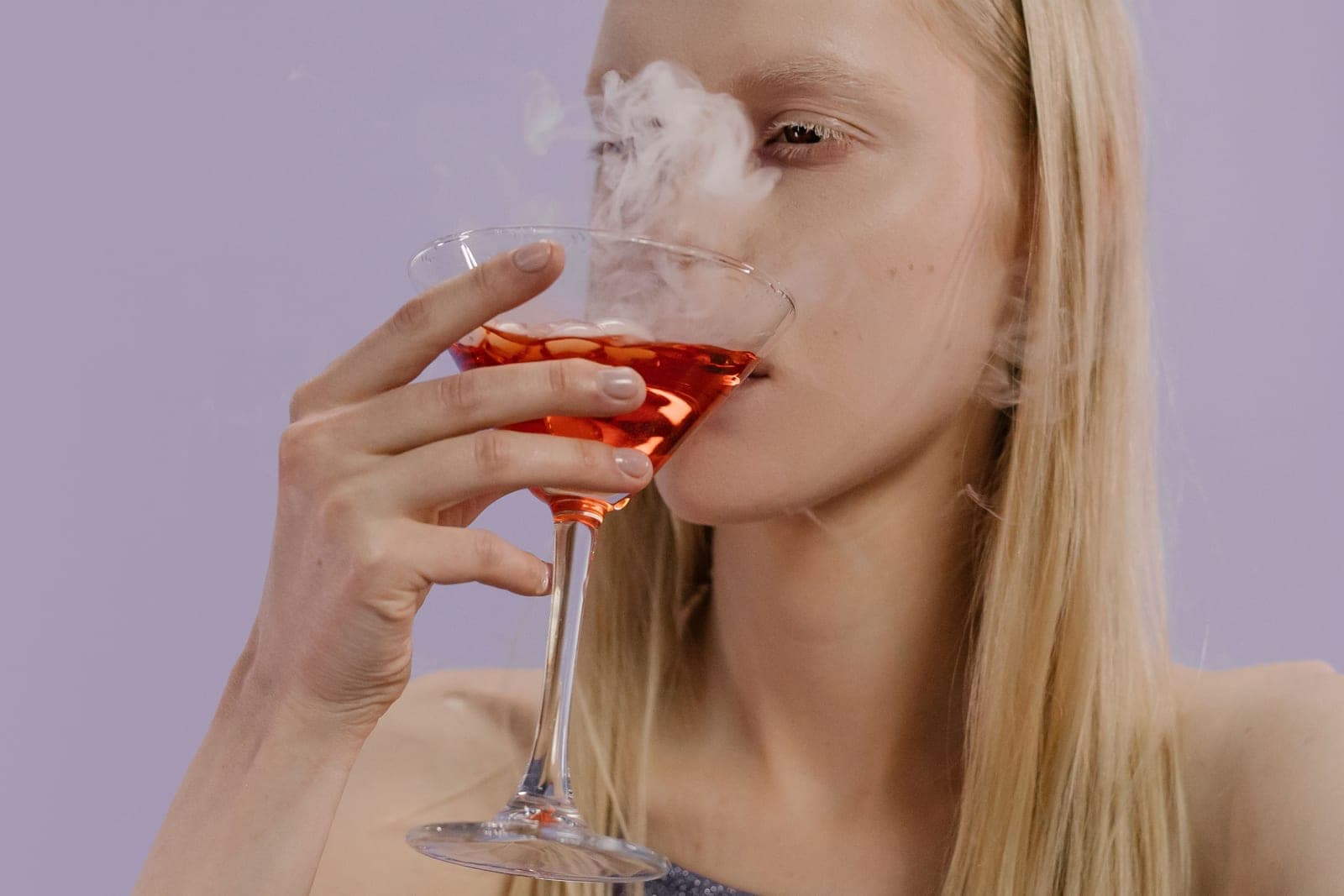 Smoke rising from a cocktail glass
